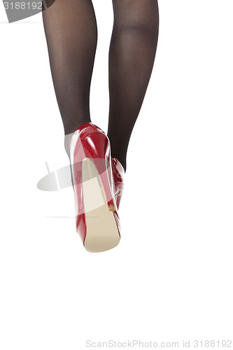 Image of Woman Legs Wearing Red Shoes and Gray Stockings