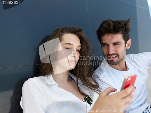 Image of young couple making selfie together at home