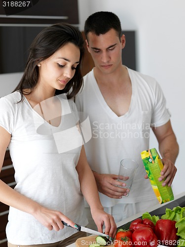 Image of happy young couple in kicthen