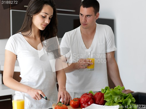 Image of happy young couple in kicthen