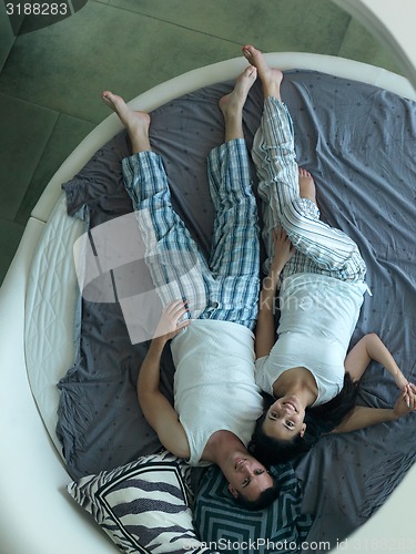 Image of couple relax and have fun in bed