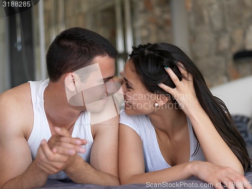 Image of couple relax and have fun in bed