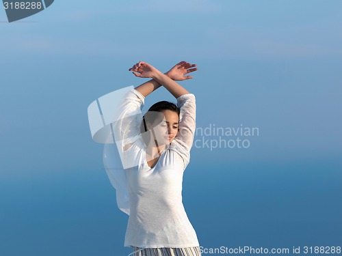 Image of young woman enjoy sunset