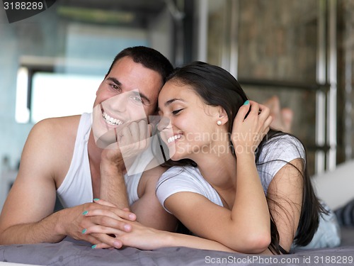 Image of couple relax and have fun in bed