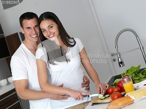 Image of happy young couple in kicthen