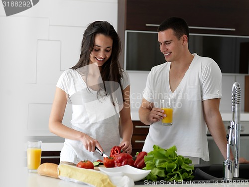 Image of happy young couple in kicthen