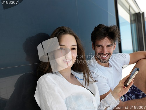 Image of young couple making selfie together at home