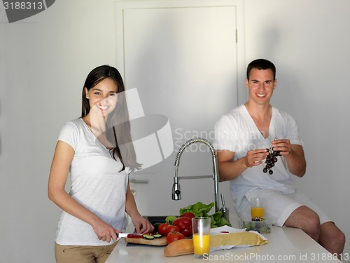 Image of happy young couple in kicthen