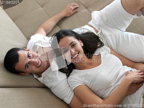 Image of relaxed young couple at home