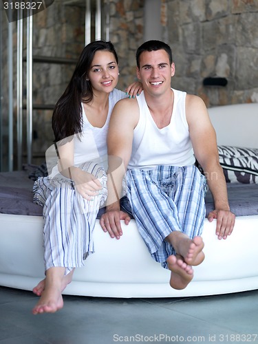 Image of couple relax and have fun in bed