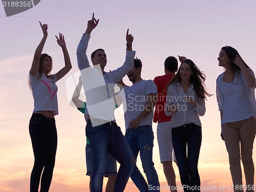 Image of party people  on sunset