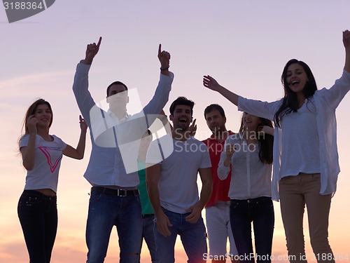 Image of party people  on sunset