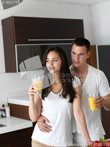 Image of happy young couple in kicthen