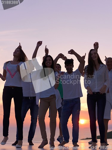 Image of party people  on sunset