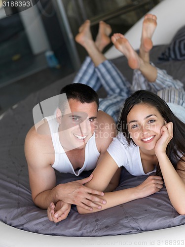 Image of couple relax and have fun in bed