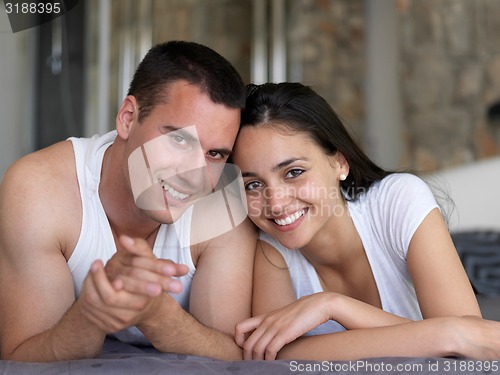 Image of couple relax and have fun in bed