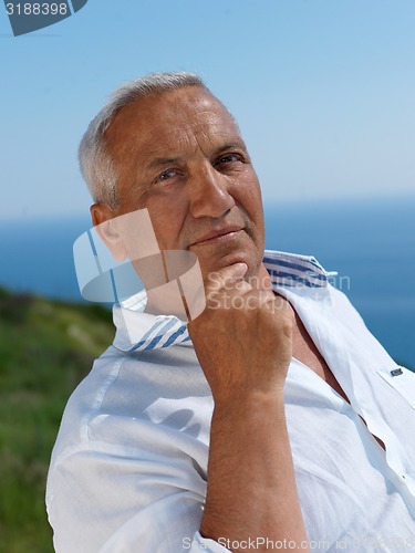 Image of senior man sitting outside