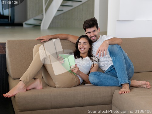 Image of young couple making selfie together at home