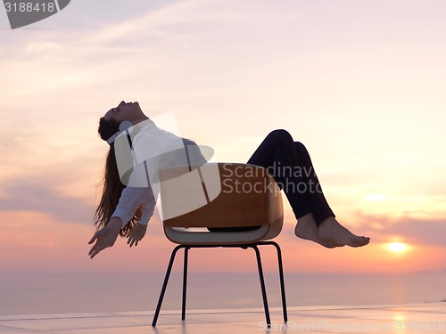 Image of young woman enjoy sunset