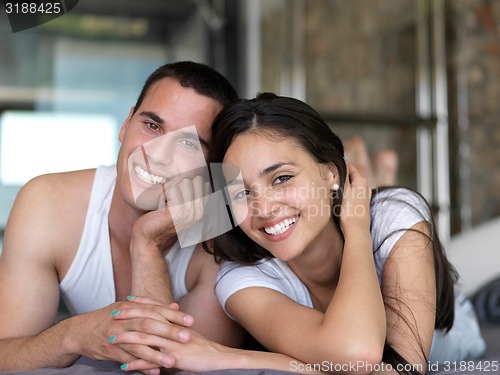 Image of couple relax and have fun in bed