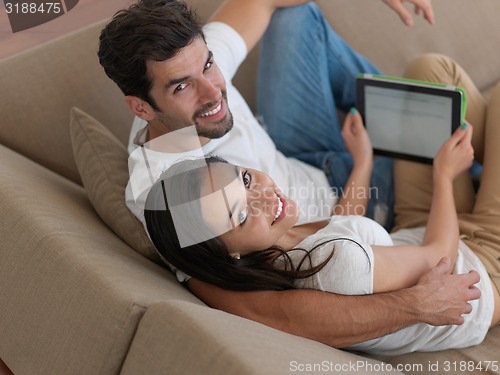 Image of young couple making selfie together at home