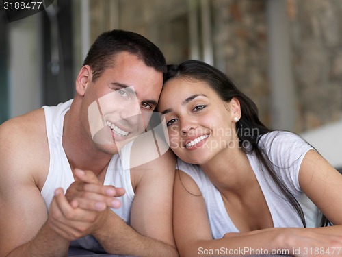 Image of couple relax and have fun in bed