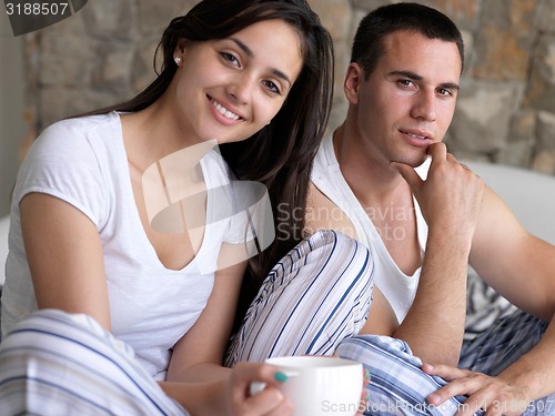 Image of couple relax and have fun in bed