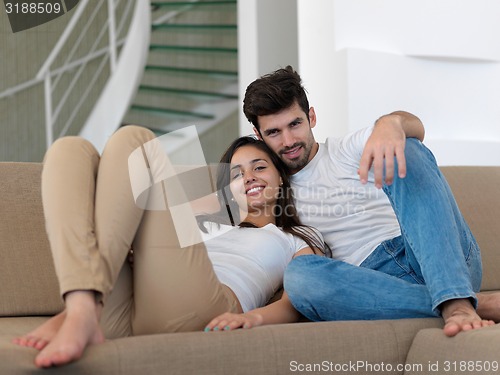 Image of young couple making selfie together at home