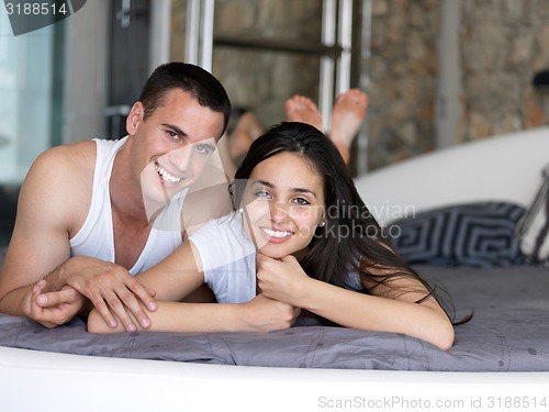 Image of couple relax and have fun in bed