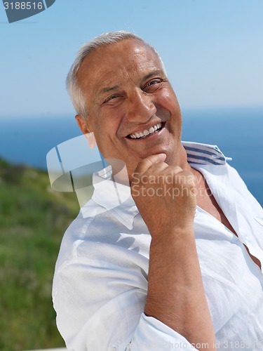 Image of senior man sitting outside