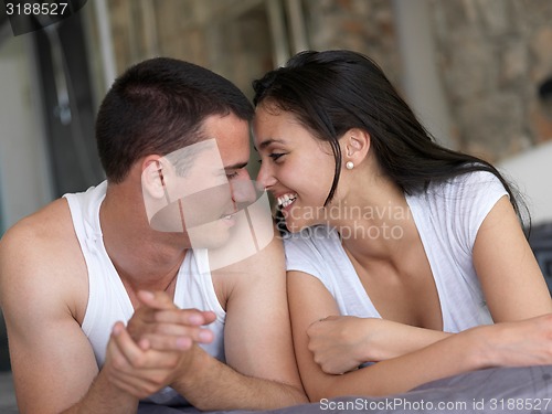 Image of couple relax and have fun in bed