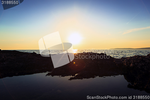 Image of Beach with rocks and a cloudy sky