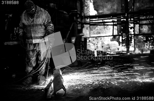 Image of Welding manwith sparks