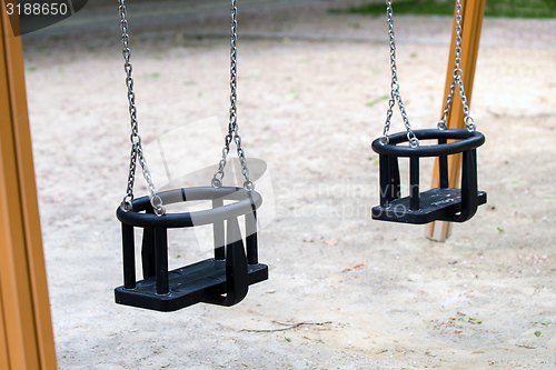 Image of Empty playground swings