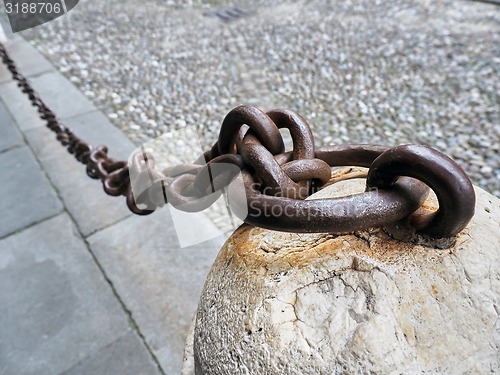 Image of Old rusty anchored Iron Chain