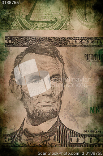 Image of Macro of Abraham Lincoln on five USA dollar banknote grunge vintage style