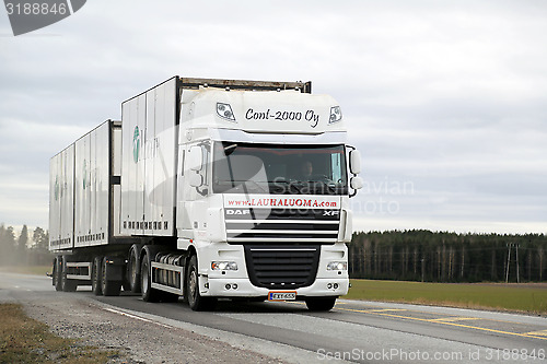 Image of White DAF XF 105  Full Trailer Truck on the Road