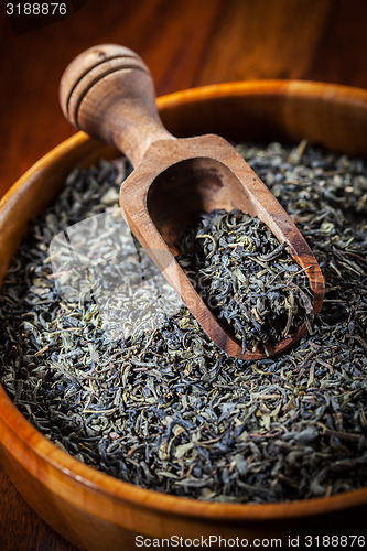 Image of Dry tea in a wooden bowl