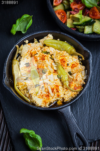 Image of Baked feta cheese with avocado salad