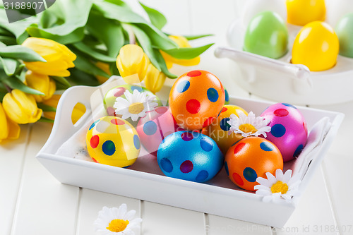 Image of Easter eggs with spring flowers