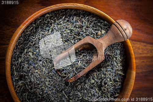 Image of Dry tea in a wooden bowl