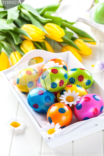 Image of Easter eggs with spring flowers