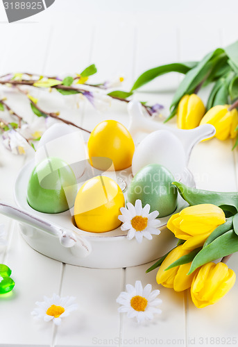 Image of Easter eggs with spring flowers