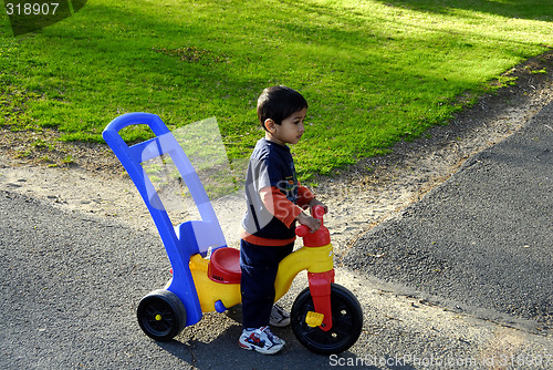 Image of Kid with Tricycle