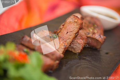 Image of organic fresh ripe roasted beef meat with sauce