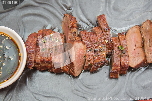 Image of organic fresh ripe roasted beef meat with sauce