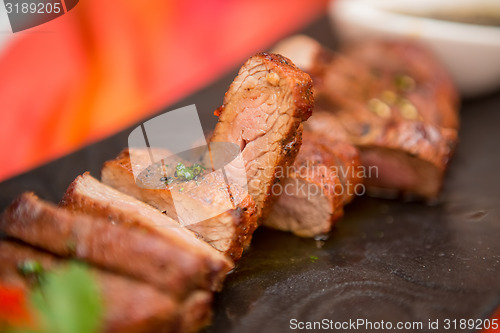 Image of organic fresh ripe roasted beef meat with sauce