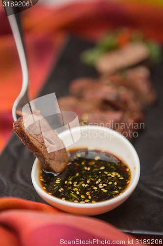 Image of organic fresh ripe roasted beef meat with sauce