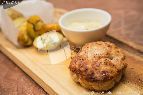 Image of Succulent cooked beef burger with potato 