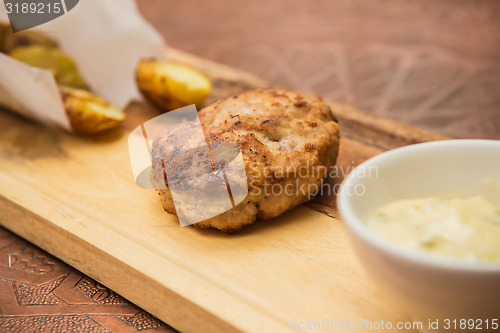 Image of Succulent cooked beef burger with potato 